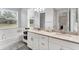 Bathroom featuring double sinks, an over-sized mirror, and a separate tub and shower at 11240 Spring Gate Trl, Bradenton, FL 34211