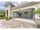 Garage interior with epoxy flooring, bike racks, and storage space at 11240 Spring Gate Trl, Bradenton, FL 34211