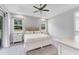 Bright, spacious bedroom with tray ceiling, fan, and lots of natural light from backyard at 11240 Spring Gate Trl, Bradenton, FL 34211