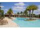 Stunning swimming pool with palm trees and lounge chairs, perfect for relaxing on sunny days at 11240 Spring Gate Trl, Bradenton, FL 34211