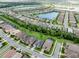 This is an aerial view of the community, showcasing the beautiful homes and community lake at 11560 Tapestry Ln, Venice, FL 34293