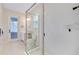 Modern bathroom showcasing a spacious glass-enclosed shower and tile surround at 11560 Tapestry Ln, Venice, FL 34293