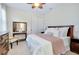 Comfortable bedroom featuring a bed, side table, and closet at 11560 Tapestry Ln, Venice, FL 34293