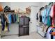 Spacious walk-in closet with plenty of hanging space, shelving, and organized storage solutions at 11560 Tapestry Ln, Venice, FL 34293