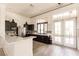 Kitchen with island and stainless steel appliances at 11560 Tapestry Ln, Venice, FL 34293