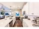 Modern kitchen with stainless steel appliances, white cabinets, and a center island at 11560 Tapestry Ln, Venice, FL 34293