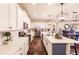 Open concept kitchen with stainless steel appliances and a center island at 11560 Tapestry Ln, Venice, FL 34293