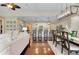 Wide angle view of the living room, kitchen and dining room showcases the open floor plan at 11560 Tapestry Ln, Venice, FL 34293