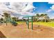 Outdoor playground with swings and jungle gym for community fun at 11560 Tapestry Ln, Venice, FL 34293