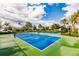 Well maintained blue and green community tennis courts at 11560 Tapestry Ln, Venice, FL 34293