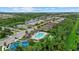 Gorgeous aerial view of the community featuring serene lakes and recreational facilities surrounded by nature at 11970 Lovegrass St, Venice, FL 34293