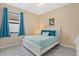 Bedroom featuring a large window and a comfortable bed with bright decor at 11970 Lovegrass St, Venice, FL 34293
