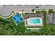 Bird's eye view of the community's pool, bocce court, and tennis courts, providing residents with recreational options at 11970 Lovegrass St, Venice, FL 34293