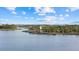 Aerial landscape of the community's park with a unique lighthouse, pier and winding path that invites exploration at 11970 Lovegrass St, Venice, FL 34293