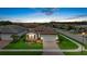 Charming single-story home with a well-manicured lawn, brick-paved driveway, and attached two-car garage at 11970 Lovegrass St, Venice, FL 34293