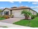Well maintained single-Gathering home, featuring a paver driveway, beautiful landscaping, and 2-car garage at 11970 Lovegrass St, Venice, FL 34293