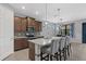 Well-equipped kitchen featuring a large island, stainless steel appliances, and barstool seating at 11970 Lovegrass St, Venice, FL 34293