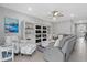 Comfortable living room with built-in shelving and a neutral color palette at 11970 Lovegrass St, Venice, FL 34293