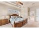 Bedroom with a decorative ceiling, a wood bed frame and matching wooden furniture at 1210 Eagles Flight Way, North Port, FL 34287