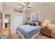 Inviting bedroom features a cozy bed, double closet, and large window with shutter blinds at 1210 Eagles Flight Way, North Port, FL 34287