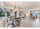 Open dining area with a view through the house at 1210 Eagles Flight Way, North Port, FL 34287