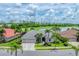 Attractive single-story home boasting meticulously landscaped grounds and serene views of a lake and golf course at 1210 Eagles Flight Way, North Port, FL 34287