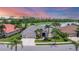 Beautiful single-story home with a well-manicured lawn and landscaping overlooking a large lake and golf course at 1210 Eagles Flight Way, North Port, FL 34287