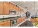 Updated kitchen with stainless steel appliances and granite countertops at 1210 Eagles Flight Way, North Port, FL 34287