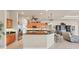 Open concept kitchen with granite countertops, stainless steel appliances, and a breakfast bar at 1210 Eagles Flight Way, North Port, FL 34287