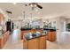 Open kitchen with a center island and views of the backyard at 1210 Eagles Flight Way, North Port, FL 34287