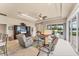 Bright living room with tray ceilings and outdoor access at 1210 Eagles Flight Way, North Port, FL 34287