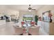 Open floor plan with a living room, dining area, and view of the backyard with a pool at 1210 Eagles Flight Way, North Port, FL 34287