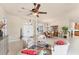 Inviting living room with neutral colors, tile flooring, and a view of the dining area and front entrance at 1210 Eagles Flight Way, North Port, FL 34287