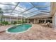 Backyard screened-in pool and patio area are great for entertaining or relaxing poolside at 1210 Eagles Flight Way, North Port, FL 34287