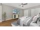 Comfortable bedroom with wood floors, natural light, and closet space at 12590 Ghiberti Cir # 201, Venice, FL 34293