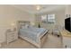 Cozy bedroom features a decorative bed, plantation shutters, and relaxing nautical decor at 12590 Ghiberti Cir # 201, Venice, FL 34293