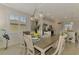 Elegant dining room adjoining the kitchen, offering a seamless flow for entertaining at 12590 Ghiberti Cir # 201, Venice, FL 34293