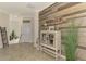 Welcoming entryway showcasing tiled floors and an accent wall with a decorative 'Gathering' sign at 12590 Ghiberti Cir # 201, Venice, FL 34293