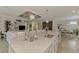 Spacious kitchen island with sink and seating, ideal for entertaining and casual dining at 12590 Ghiberti Cir # 201, Venice, FL 34293