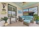 Inviting screened lanai with comfortable seating and serene views of the community at 12590 Ghiberti Cir # 201, Venice, FL 34293