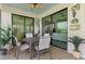 Screened patio with dining area that is well-lit with views of the neighborhood and manicured landscaping at 12590 Ghiberti Cir # 201, Venice, FL 34293