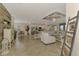 Spacious open-plan living area with tile flooring, neutral tones, and stylish furnishings at 12590 Ghiberti Cir # 201, Venice, FL 34293