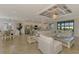 Open concept living space featuring living room, kitchen, and dining area with neutral decor at 12590 Ghiberti Cir # 201, Venice, FL 34293