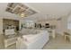 Open-concept area features a living room, kitchen and dining area, and custom ceilings at 12590 Ghiberti Cir # 201, Venice, FL 34293