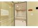 Bright steam room features tile flooring, bench seating, and recessed lighting at 12590 Ghiberti Cir # 201, Venice, FL 34293