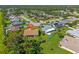 Aerial view of a home in a neighborhood with lush greenery and well-maintained lawns at 1315 Pine Needle Rd, Venice, FL 34285