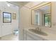 Bathroom featuring a vanity and a view to the shower and the yard at 1315 Pine Needle Rd, Venice, FL 34285