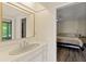 Bathroom vanity featuring ample counter space and a view to a bedroom at 1315 Pine Needle Rd, Venice, FL 34285