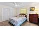 Comfortable bedroom featuring neutral walls, carpet floors, ceiling fan, and a window for natural light at 1315 Pine Needle Rd, Venice, FL 34285