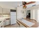 Well-lit kitchen with a center island and a full-sized refrigerator at 1315 Pine Needle Rd, Venice, FL 34285